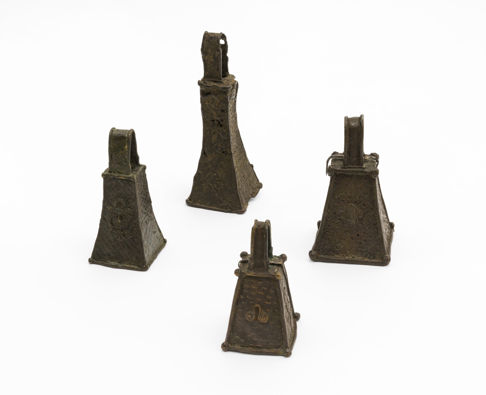 Four bells from the kingdom of Benin which probably adorned the armour of members of the military. Purchased sometime netween 1904 and 1906 from the company J.F.K Umlauff and from Hans Schaumburg. Weltkulturen Museum Collection. Photo: Wolfgang Günzel.