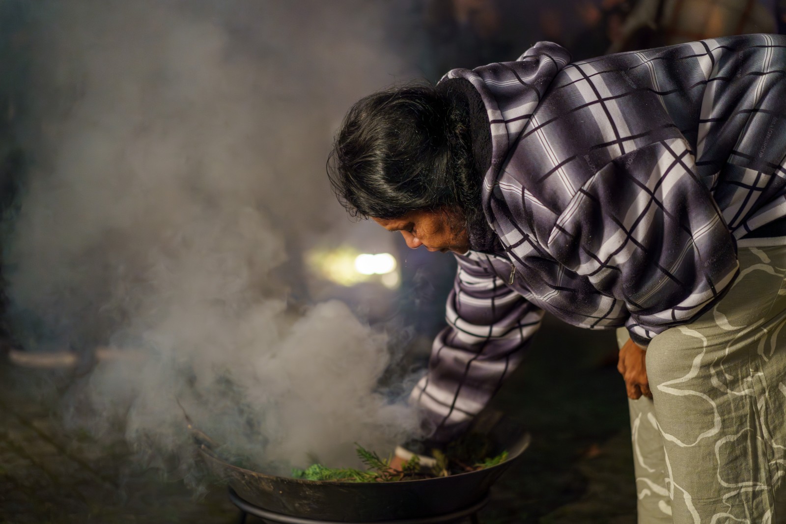 Traditional Owner Inga Pedersen during the Welcome Smoking. Photo: Esra Klein