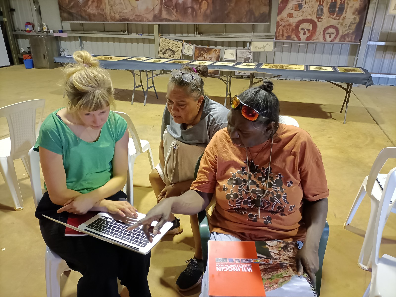 Kirsty Burgu, Leah Umbagai and Christina Henneke talk about archive material. Photo: Kim Doohan