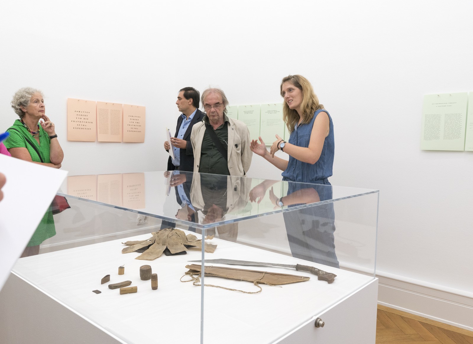 Visitors at the exhibition opening of COLLECTED. BOUGHT. LOOTED?, Weltkulturen Labor 2018