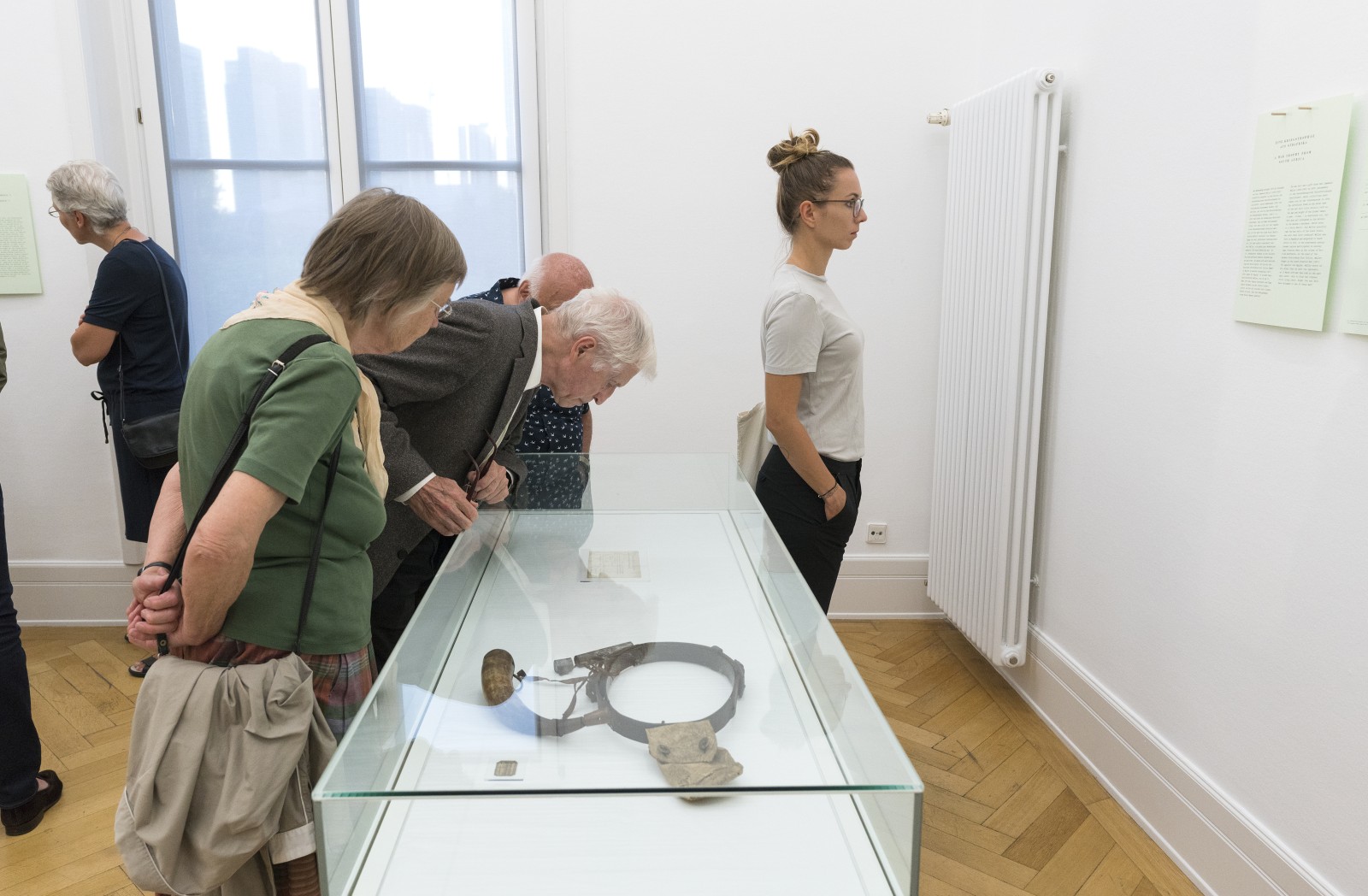 Visitors at the exhibition opening of COLLECTED. BOUGHT. LOOTED?, Weltkulturen Labor 2018