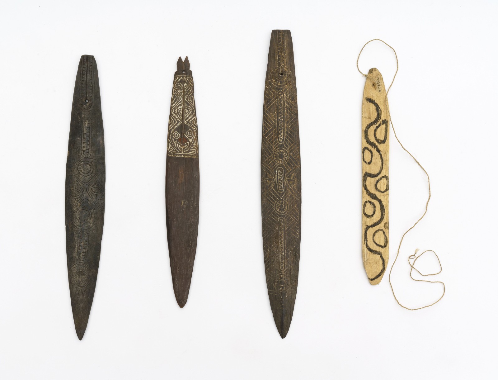 The sound of the bullroarer often represents the voices of ancestors or spirits. Bullroarers from the Amazon region and New Guinea.