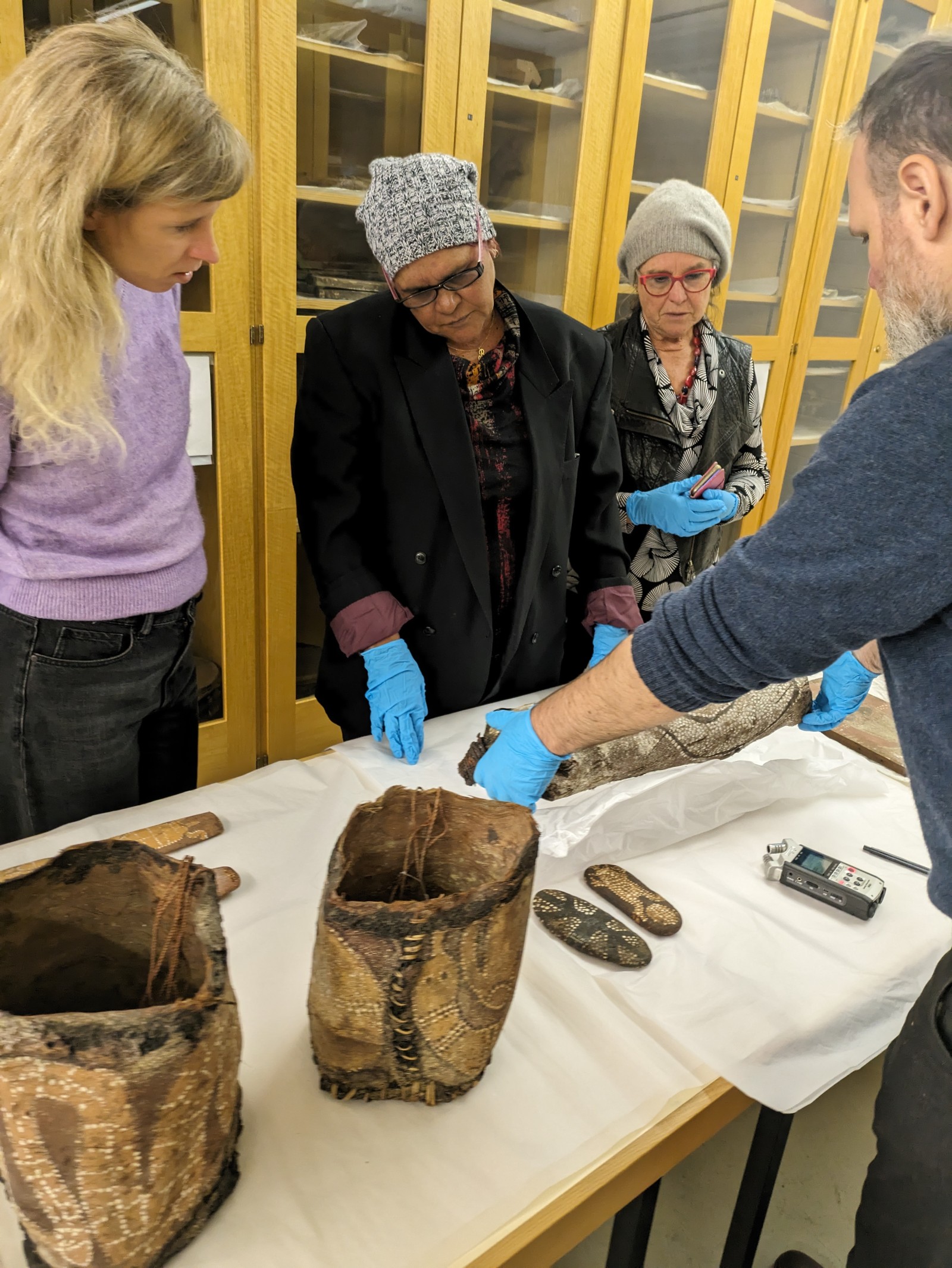Christina Henneke, Rona Charles, Kim Doohan and Matthias Claudius Hofmann in the depot of the Weltkulturen Museum